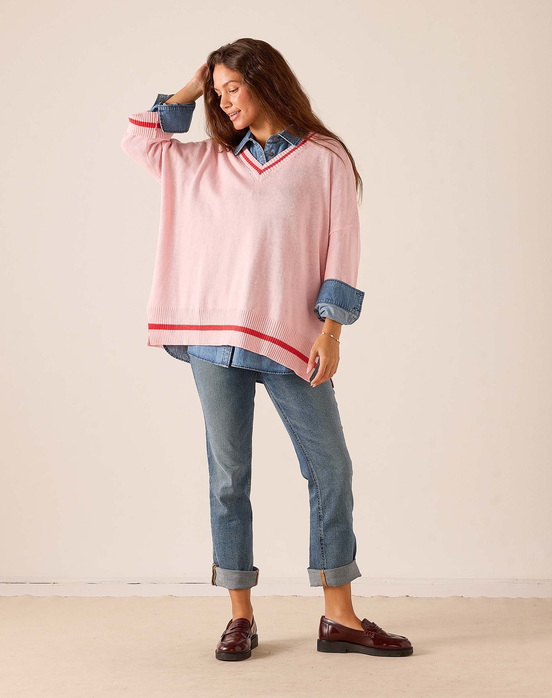 MERSEA women's travel-friendly pink and red V-neck knit sweater with oversized sleeves and horizontal stripe detailing.