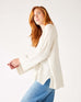 profile of woman wearing mersea montauk v-neck sweater with wide sleeves in cream color