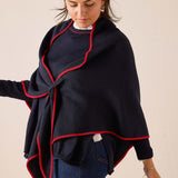 Navy blue wrap scarf with a red trim detail.