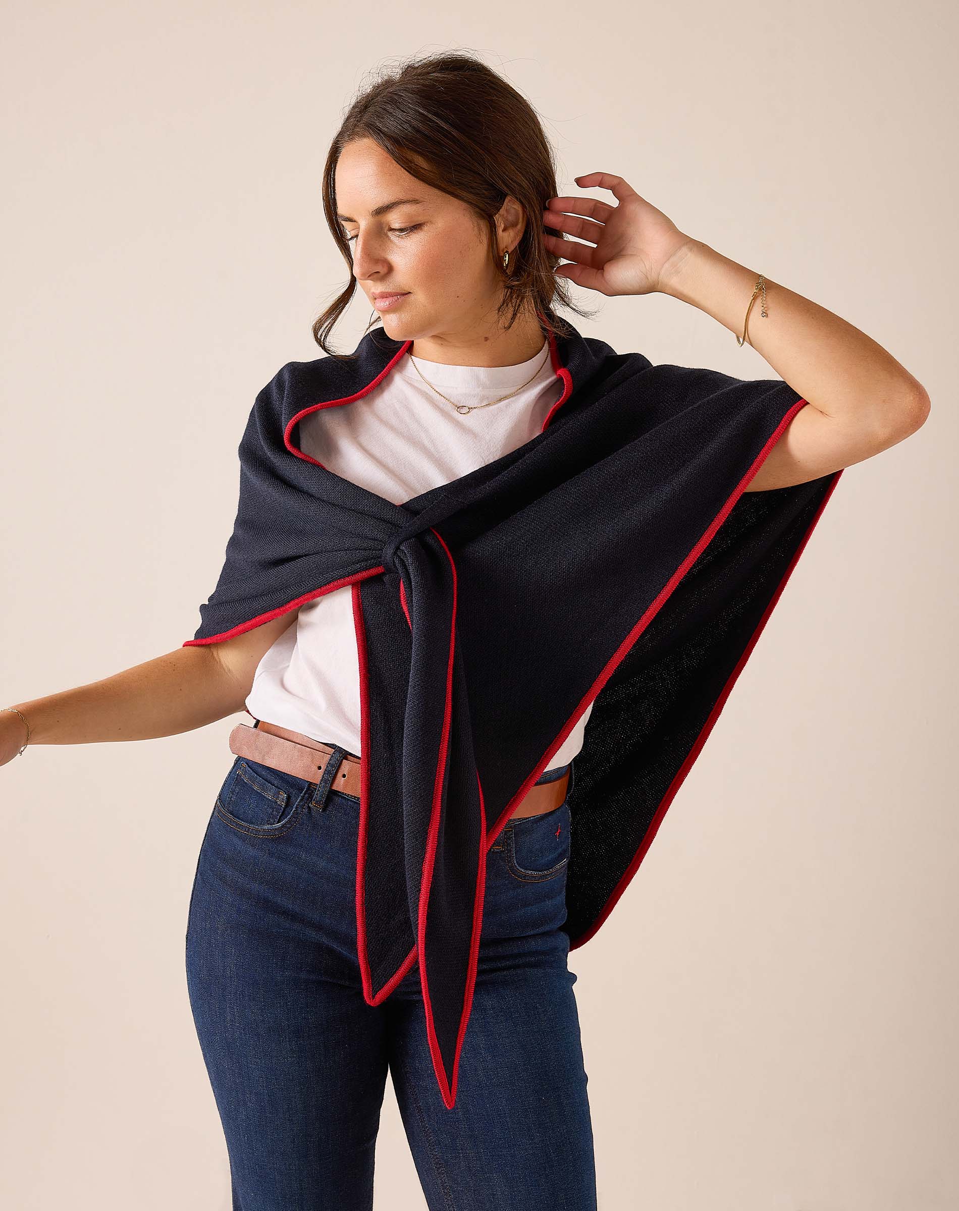 Navy blue and red travel scarf with a soft drape and cozy knit feel.