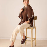 Coffee brown wrap with cream trim in a soft knit material.