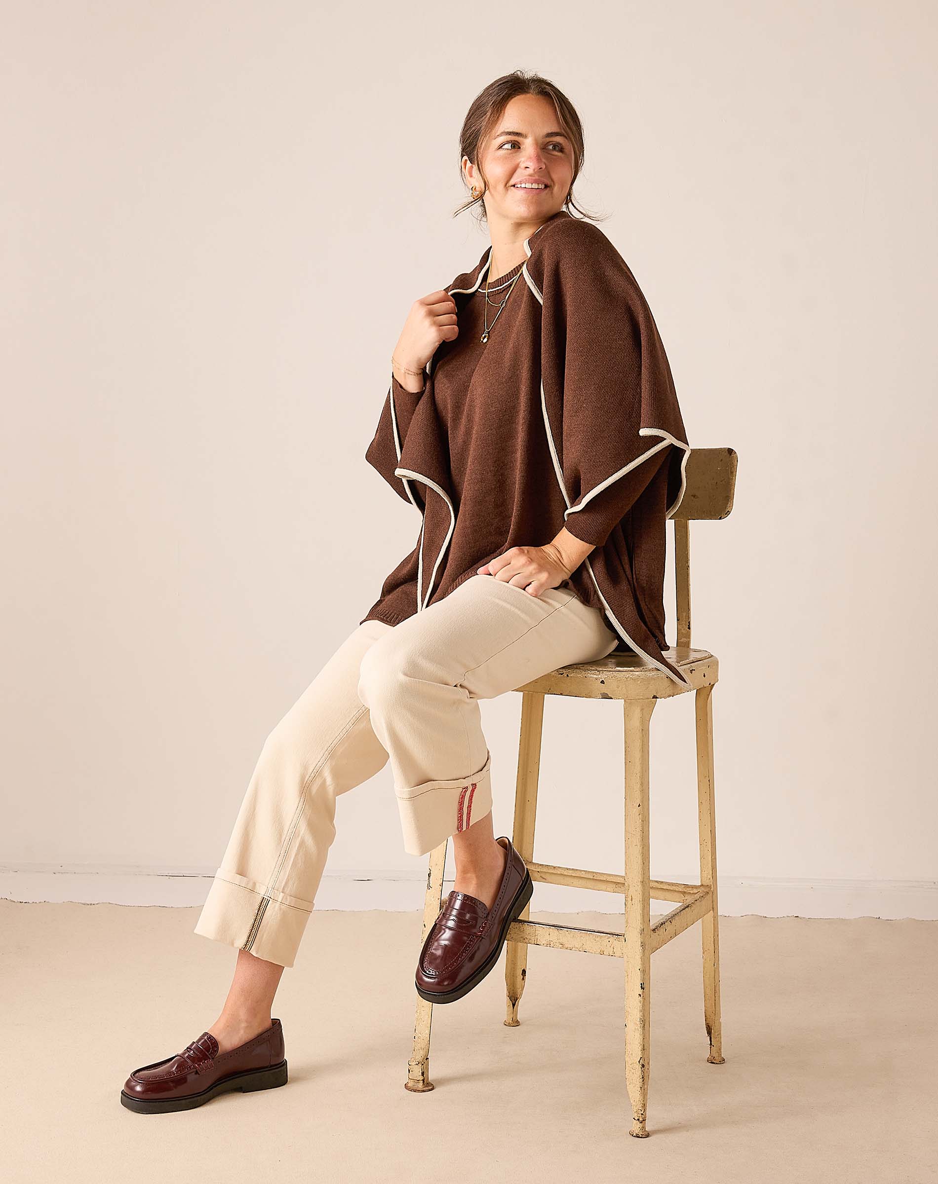 Coffee brown wrap with cream trim in a soft knit material.