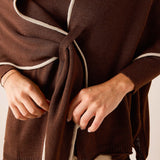 Coffee and cream color knit scarf with a front knot detail.