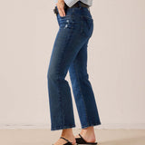 Medium wash blue denim wide-leg jeans featuring a relaxed fit and distressed detailing