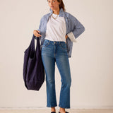 MERSEA women's travel-friendly navy blue oversized tote bag with top handles and wide shoulder straps.
