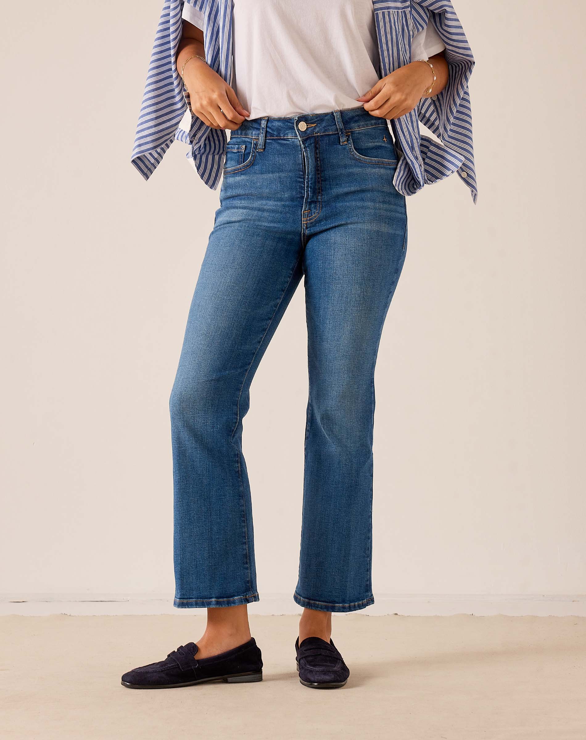 Mid-wash blue denim wide-leg jeans with a straight-leg silhouette.