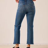 Blue-wash denim-style relaxed fit flared-leg pants with stitched back pocket details.