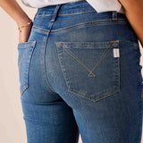 Blue denim jeans featuring back pocket detailing and a stitched western-style yoke.