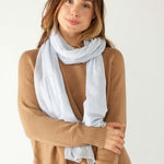 woman wearing mersea napa cashmere scarf in airy blue