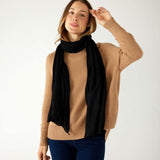 woman wearing mersea napa cashmere scarf in black