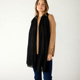 woman wearing mersea napa cashmere scarf in black