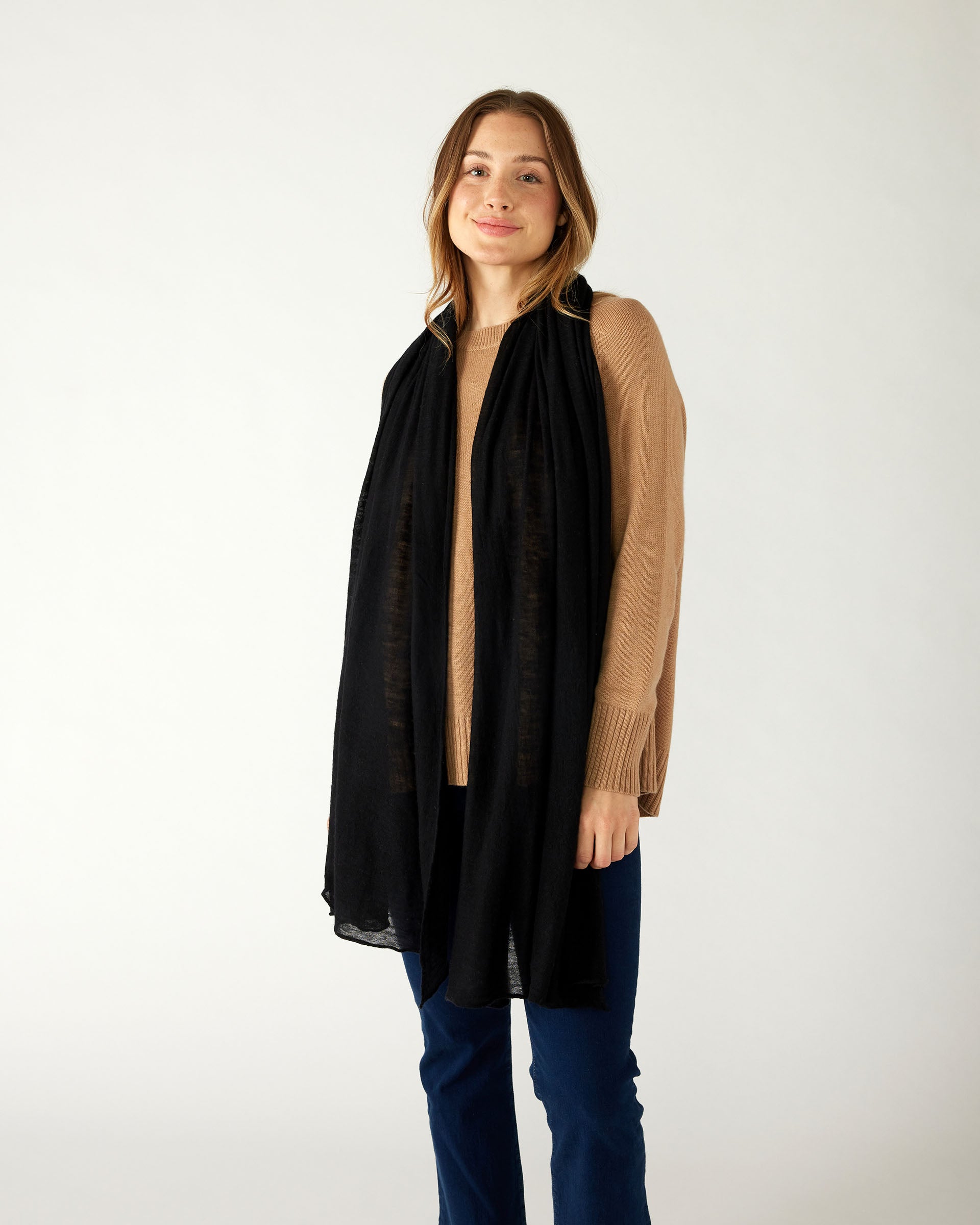 woman wearing mersea napa cashmere scarf in black