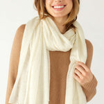 closeup of woman wearing mersea napa cashmere scarf in moonstone white