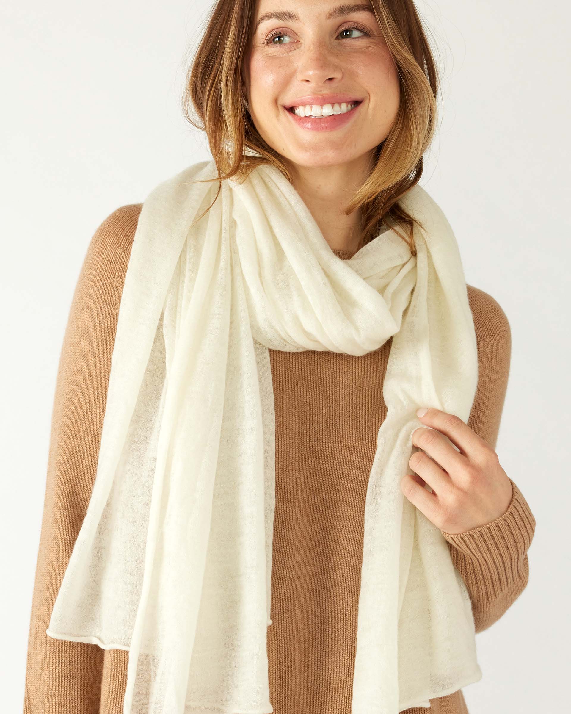 closeup of woman wearing mersea napa cashmere scarf in moonstone white