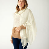 woman wearing mersea napa cashmere scarf in moonstone white