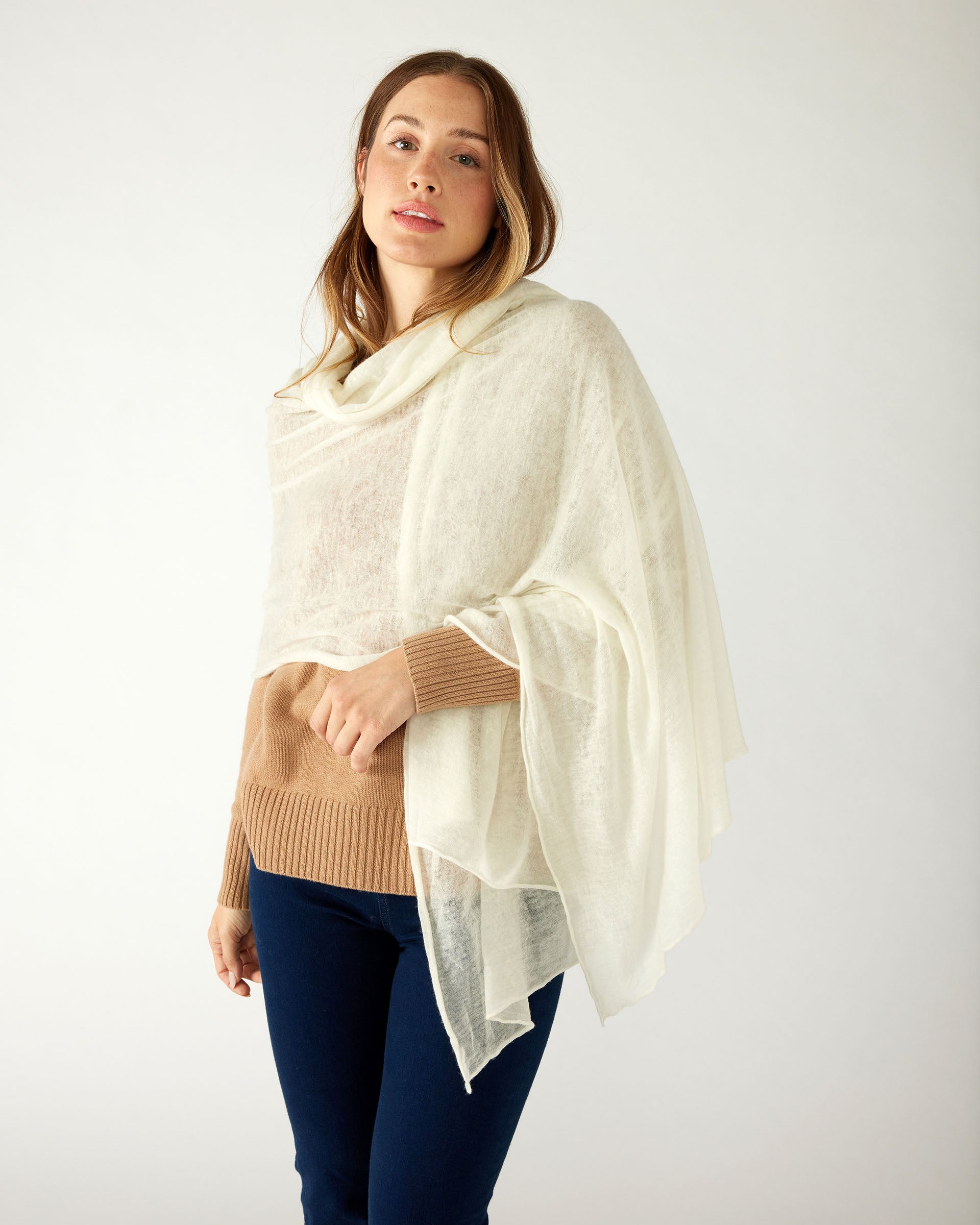 woman wearing mersea napa cashmere scarf in moonstone white