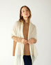 woman wearing mersea napa cashmere scarf in moonstone white