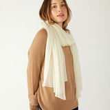 woman wearing mersea napa cashmere scarf in moonstone white