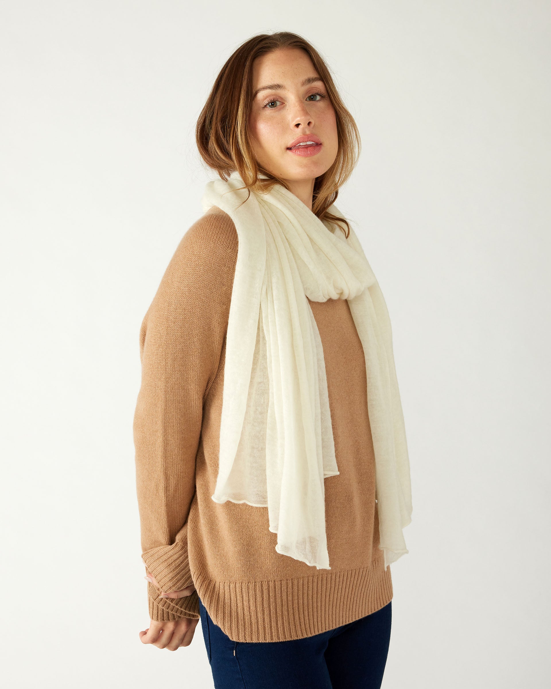 woman wearing mersea napa cashmere scarf in moonstone white