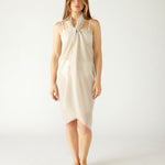 woman wearing lightweight mersea nellie wrap in neutral moonstone color wrapped around body