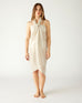 woman wearing lightweight mersea nellie wrap in neutral moonstone color wrapped around body