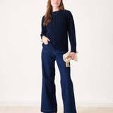 Ladies' travel-ready navy blue ribbed knit sweater featuring a relaxed fit and long sleeves.