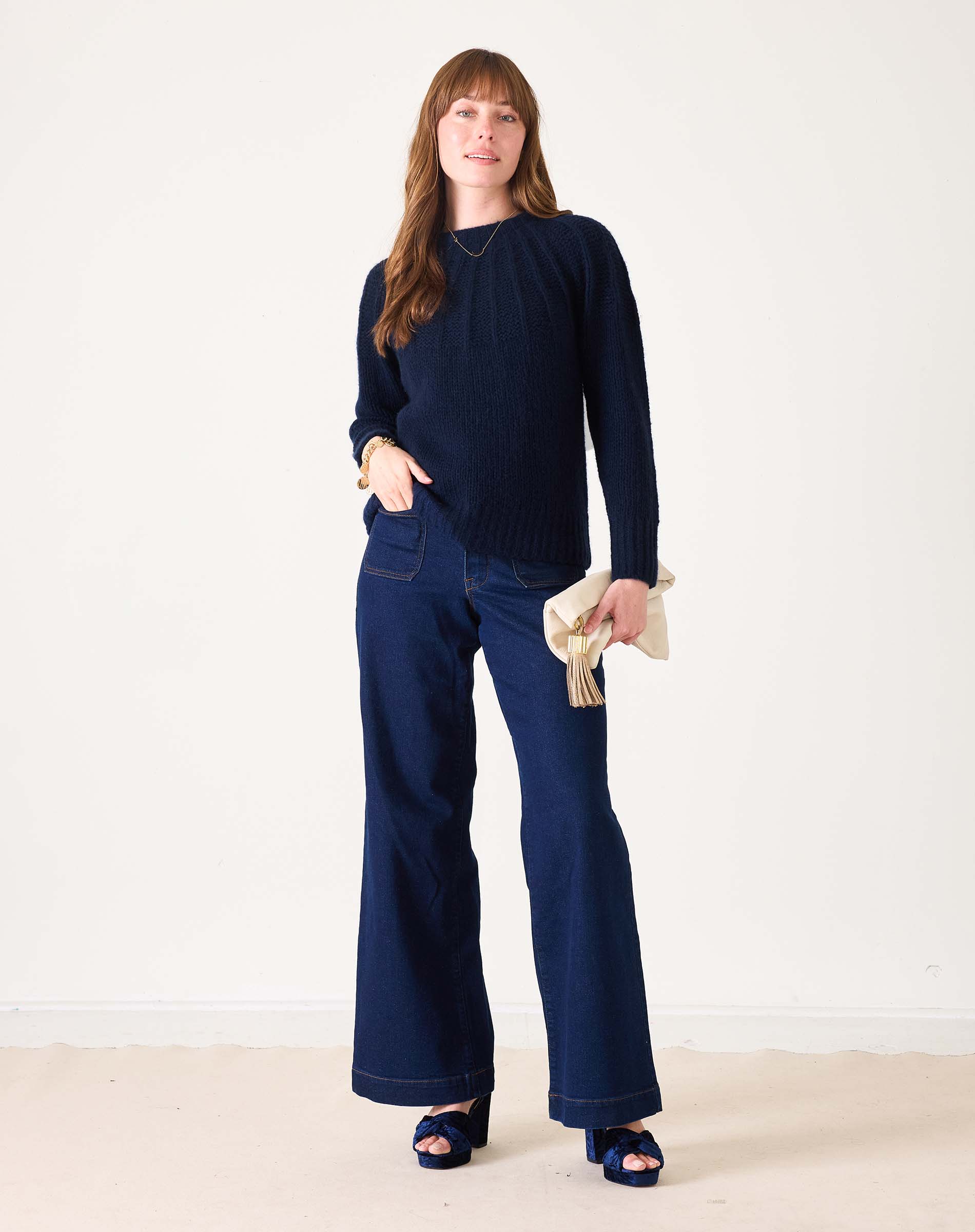 Ladies' travel-ready navy blue ribbed knit sweater featuring a relaxed fit and long sleeves.