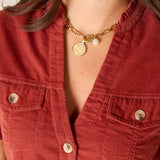 MERSEA women's travel-friendly women's travel-friendly close-up of the terracotta-colored ribbed texture and buttons on the Oakley dress.