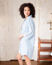 side view of woman wearing over the cotton moon nightshirt in bedroom