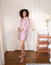 woman in bedroom wearing over the cotton moon nightshirt