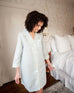 woman wearing over the cotton moon nightshirt in bedroom