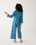 rearview of woman wearing mersea matching pajama set with elephant garden print 