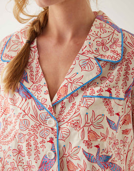 closeup of collar on woman wearing mersea matching pajama set with peacock vines print