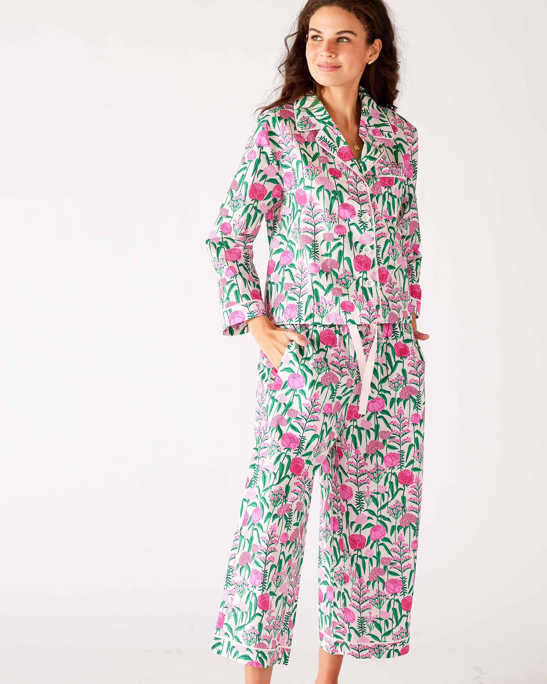 woman wearing over the cotton moon pjs in peony party with hands in pockets