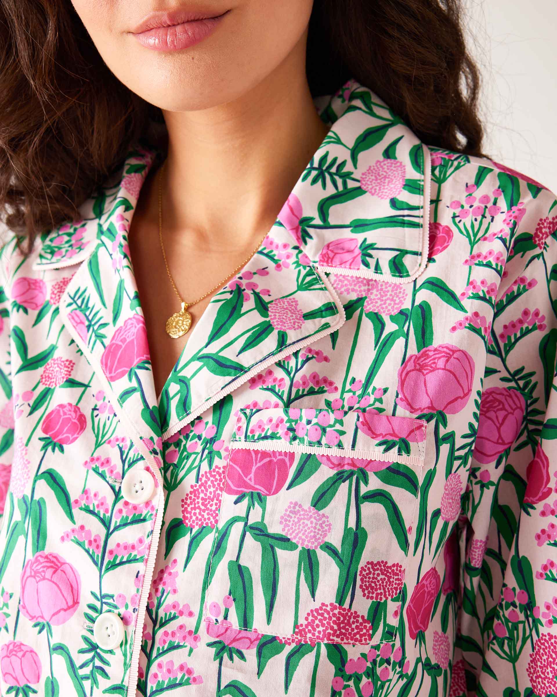 close up of neckline of woman wearing over the cotton moon pjs in peony party