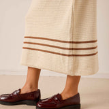 Ecru and almond crochet skirt featuring horizontal stripe detailing and a wide hem.