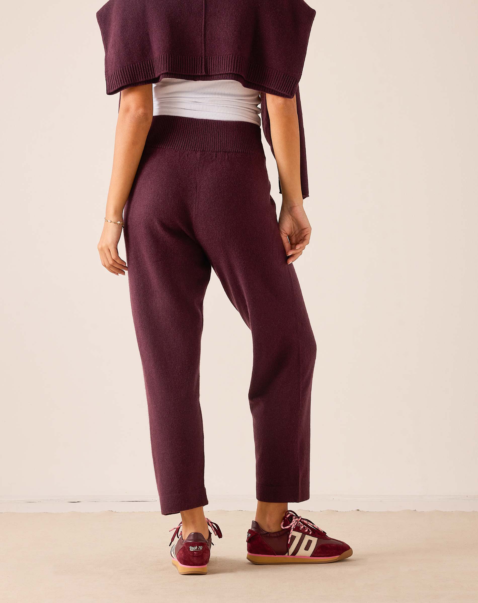 Plum cashmere tapered pants with a knit finish and a comfortable fit.
