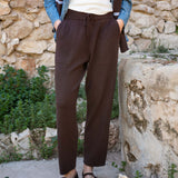 Truffle brown cashmere tapered pants with an elastic waistband and drawstring.