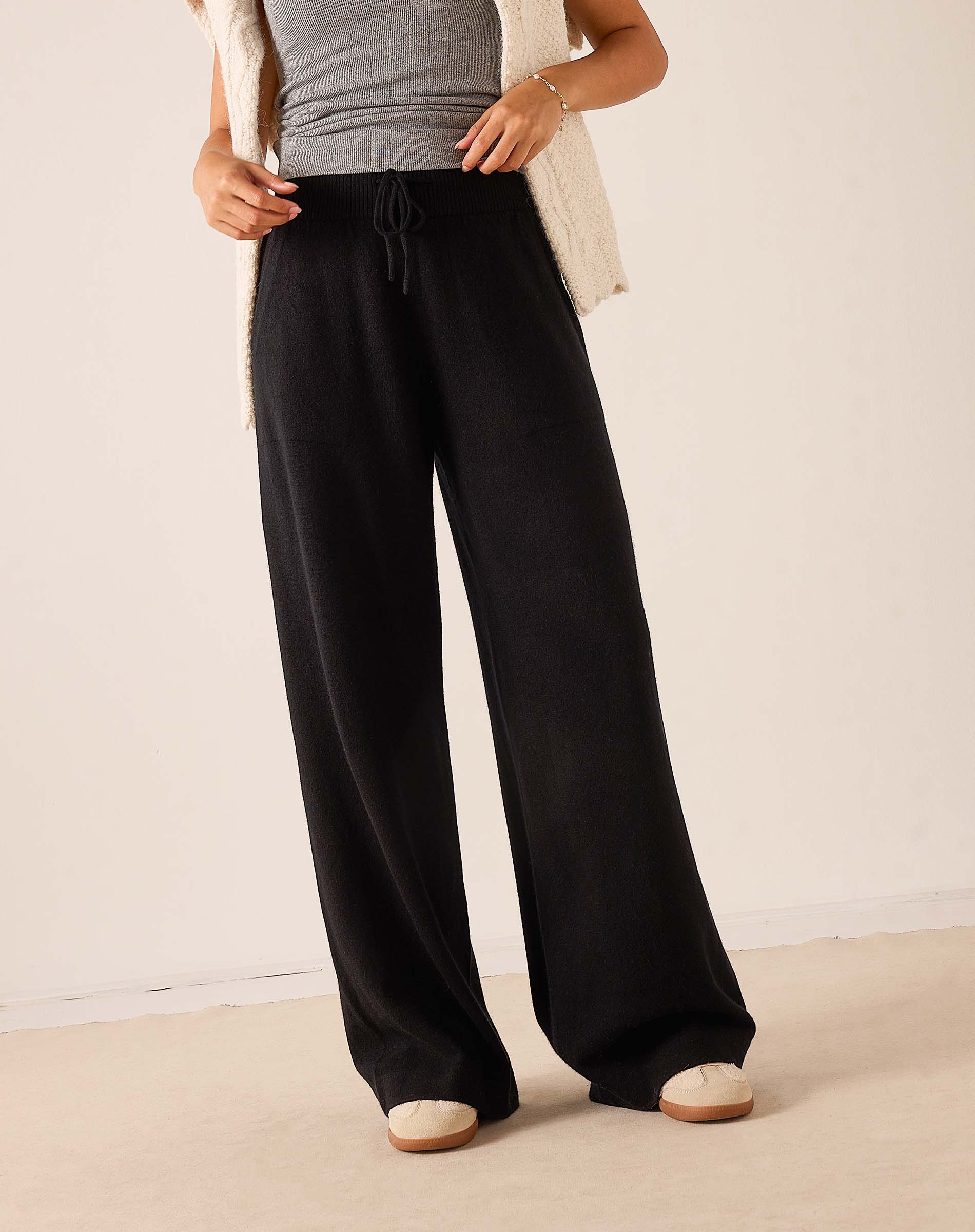 Black wide-leg cashmere pants with a drawstring waist