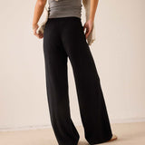 Black wide-leg cashmere pants featuring a soft knit finish.