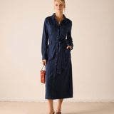 Navy blue button-front maxi dress with a waist tie and functional pockets.