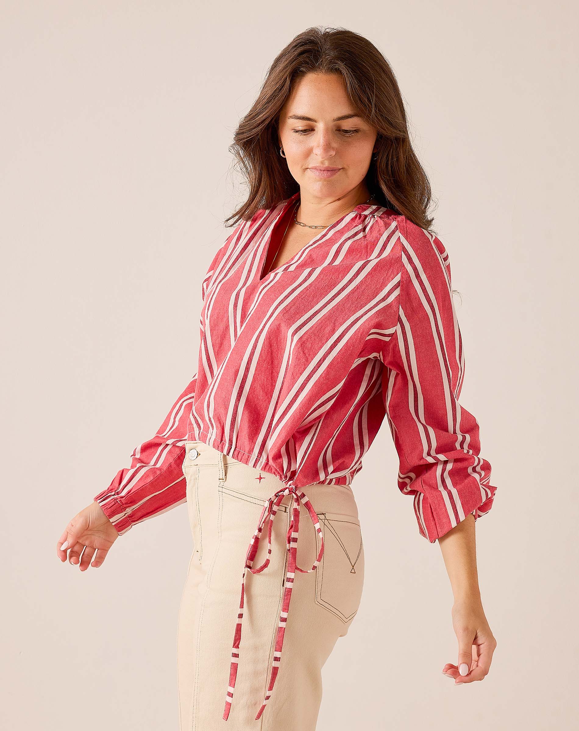 Rojo stripe poet long sleeve blouse in a light, flowing fabric with gathered cuffs and a relaxed fit.