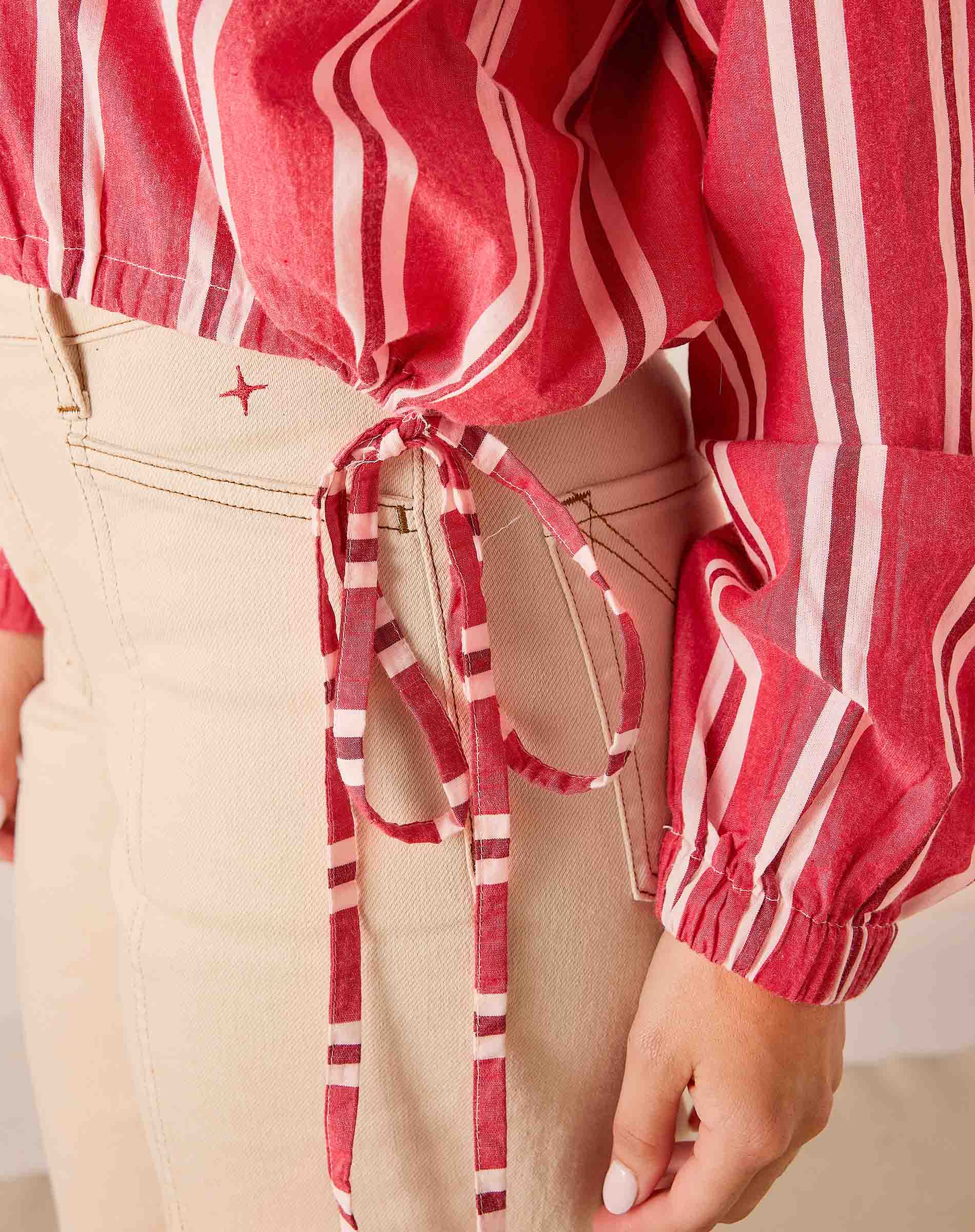 Rojo red and white striped cotton poet top featuring a drawstring waist and puffed sleeves.