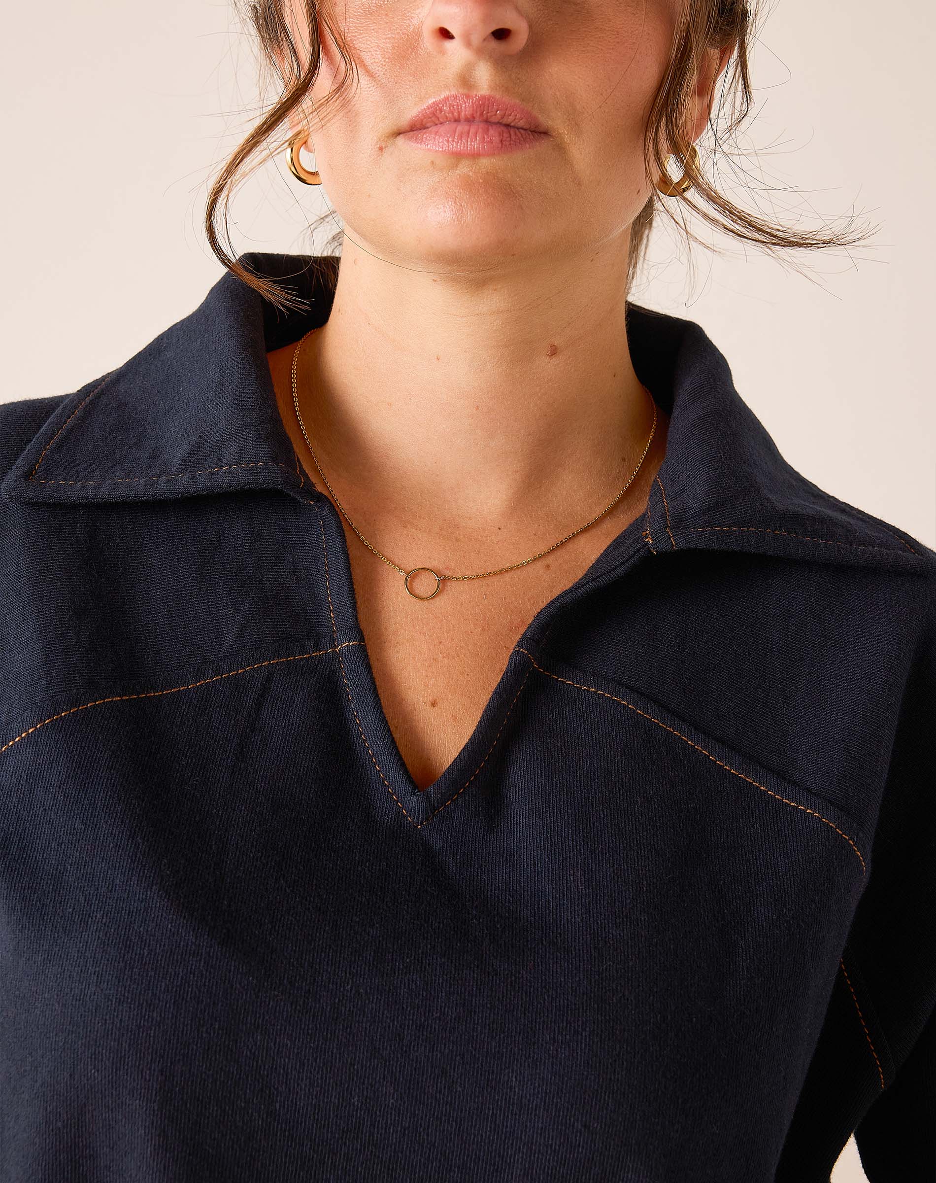Navy blue relaxed fit textured cotton popover with a V-neckline and decorative stitching.