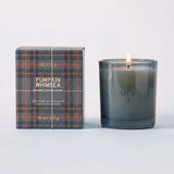 MERSEA ladies' travel-ready pumpkin Whimsea scented soy candle in a frosted glass jar with a matching plaid-patterned box. Text: 'MERSEA', 'PUMPKIN WHIMSEA', 'SCENTED SOY CANDLE', '10 oz / 283 g'