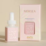 pura smart vial of mersea coconut sugar scent sitting next to boxed version of product