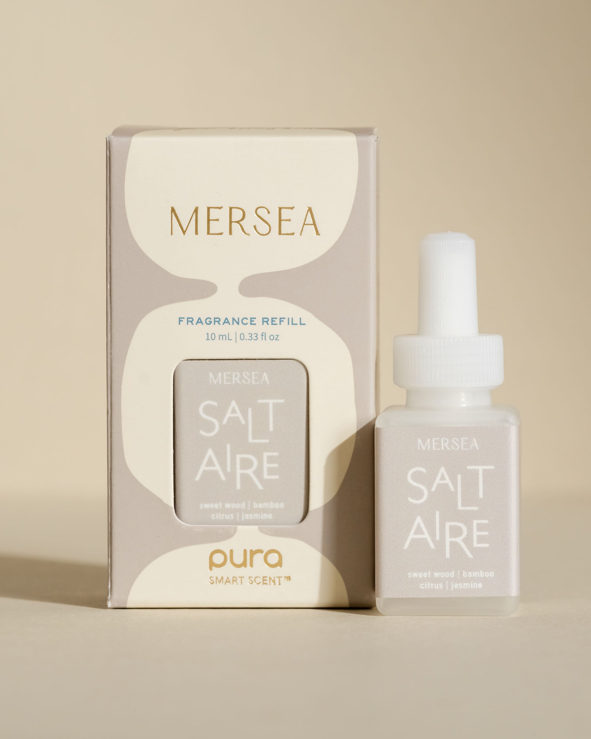 pura smart vial of mersea saltaire scent sitting next to boxed version of product