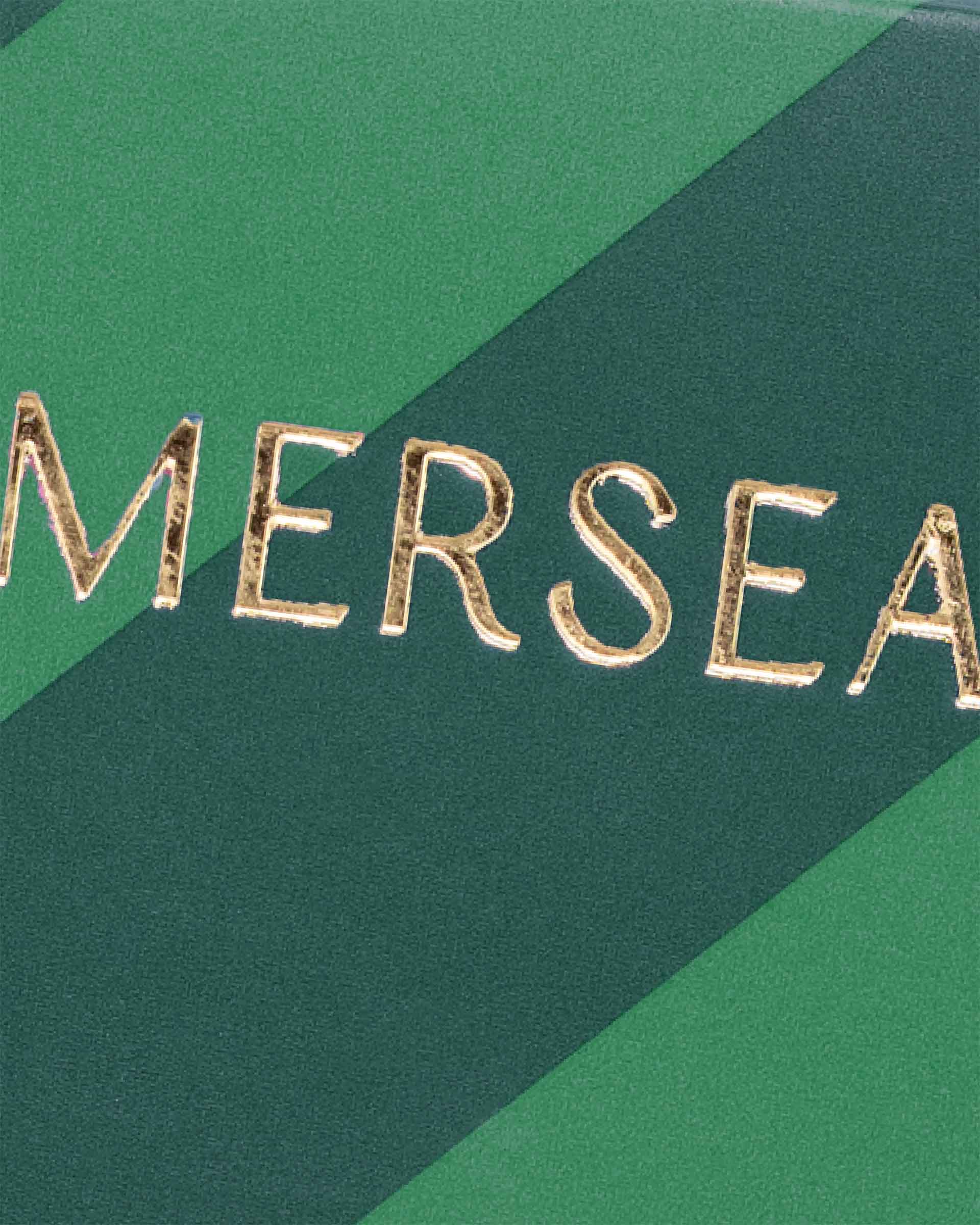Gold text 'MERSEA' on a green background