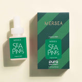 Mersea Sea Pines fragrance bottle and packaging on a beige background