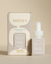 pura smart vial of mersea saltaire scent sitting next to boxed version of product